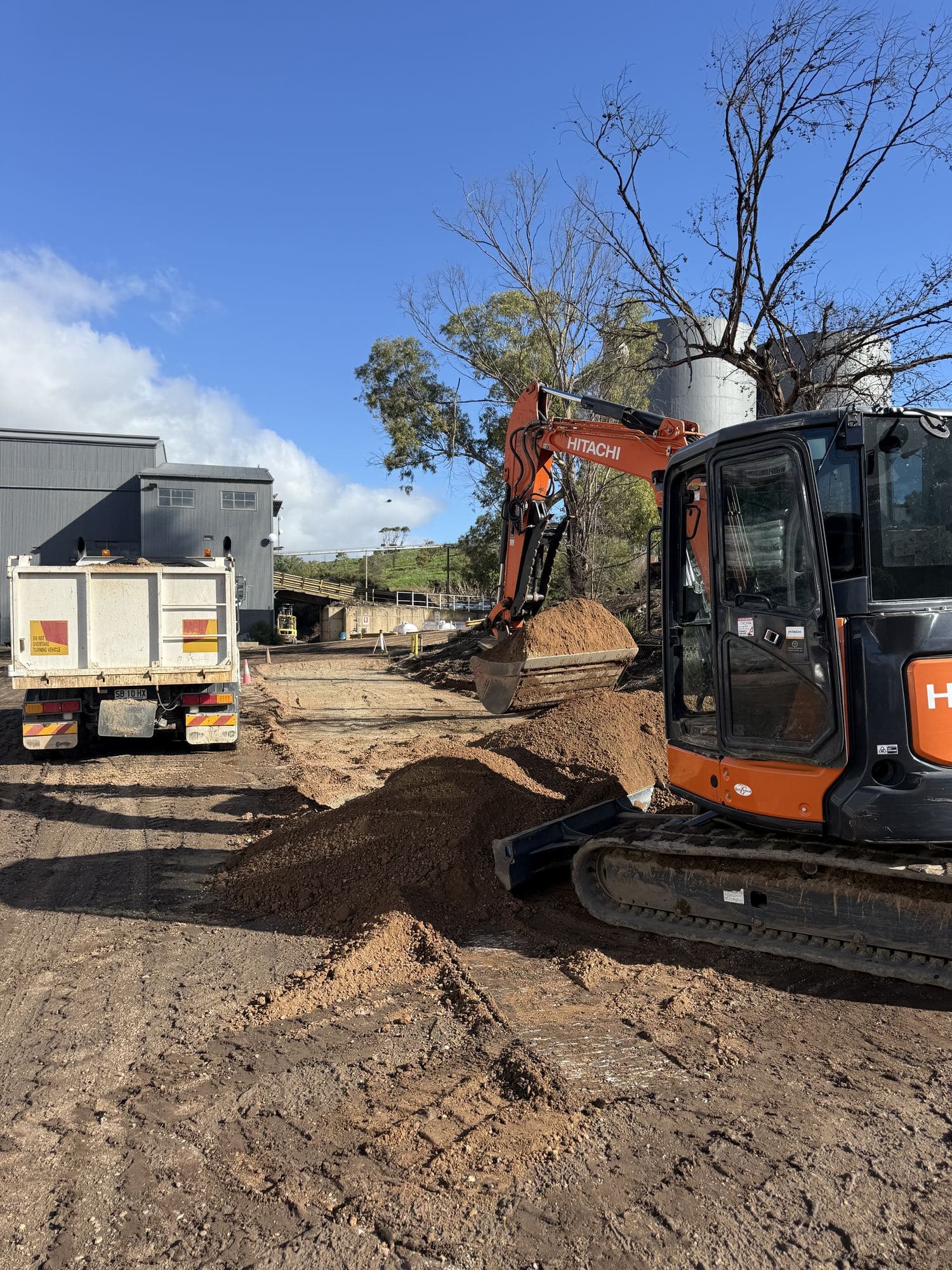 Digging It Earthworx excavator moving dirt on site